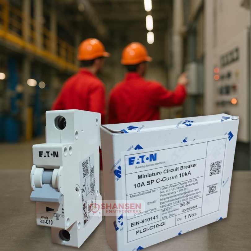 Eaton PLSI-C10-GI 10A MCB with packaging in factory, two engineers in red uniforms inspecting control panel