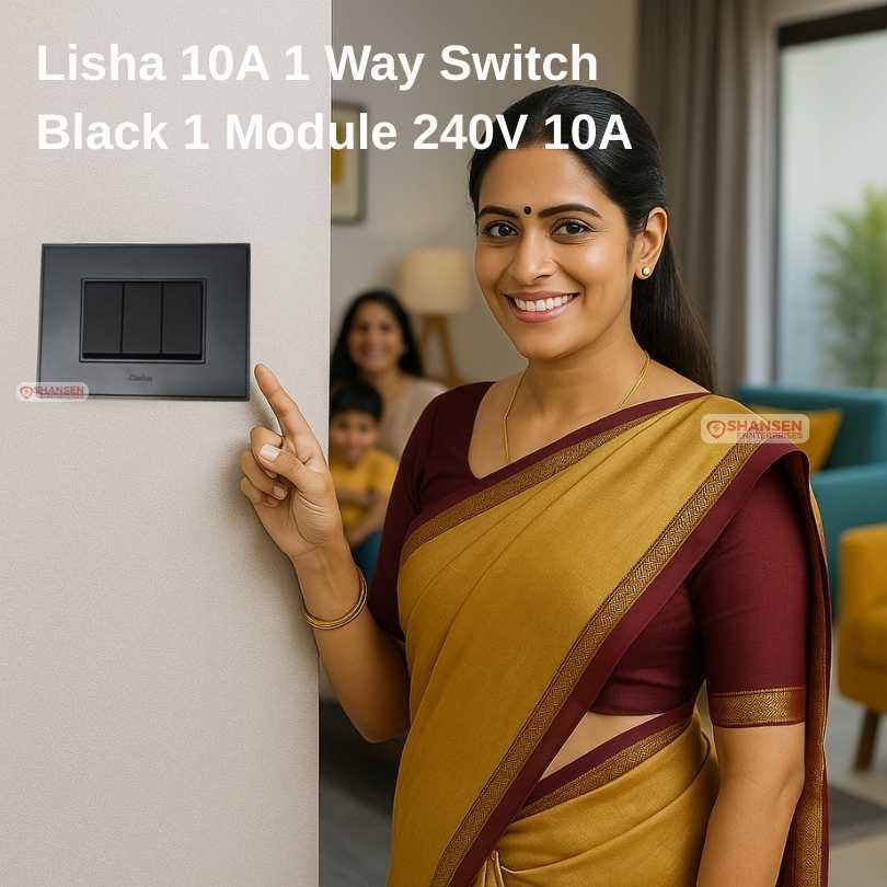 Indian woman in saree smiling while pointing at a Lisha 10A 1 Way Black Modular Switch installed in a modern living room